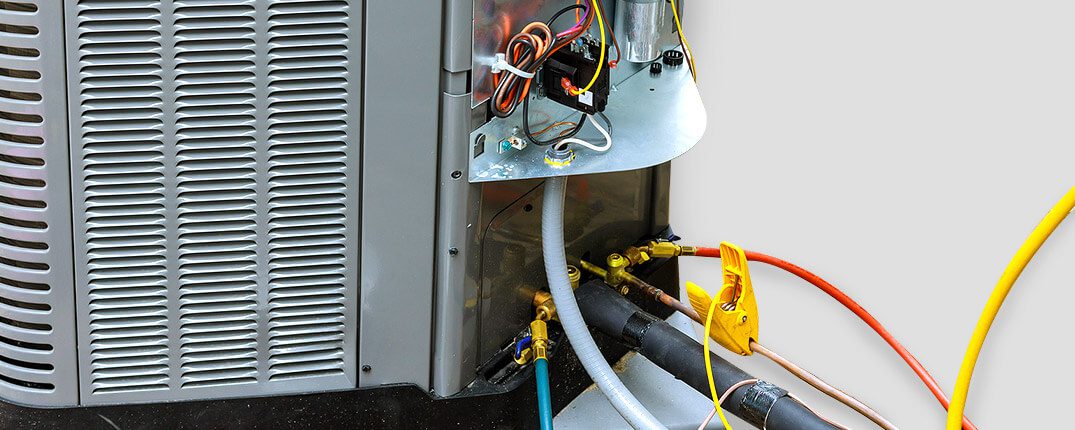 DunRite Heating & Air Inc. - Amana heater under repair