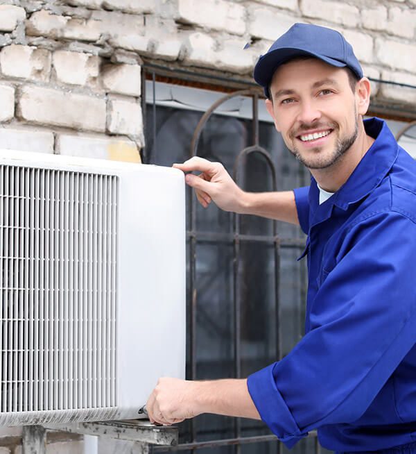 DunRite Heating & Air Inc. - checking the filter of the aircon