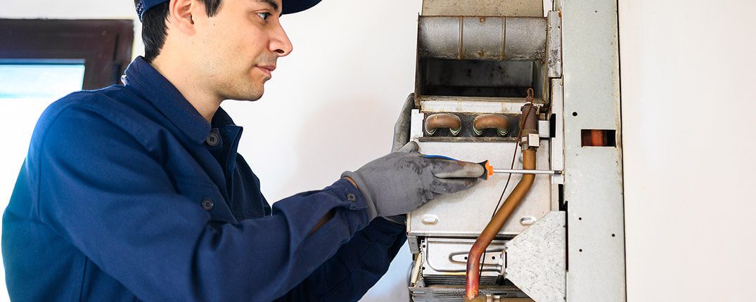 DunRite Heating & Air Inc. - putting back the heater for checking