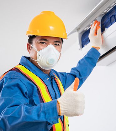 DunRite Heating & Air Inc. - technician cleaning the split aircon